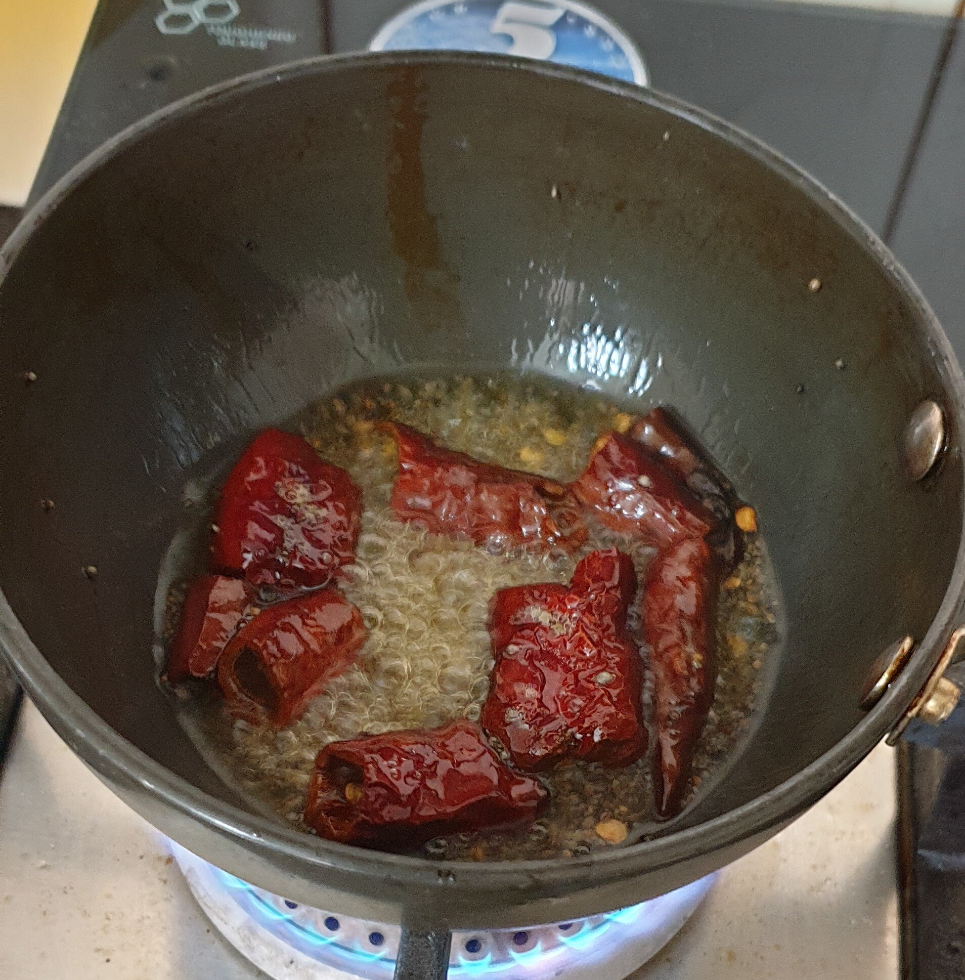 Add Mustard Seeds, Red Chillies, and Urad Dal