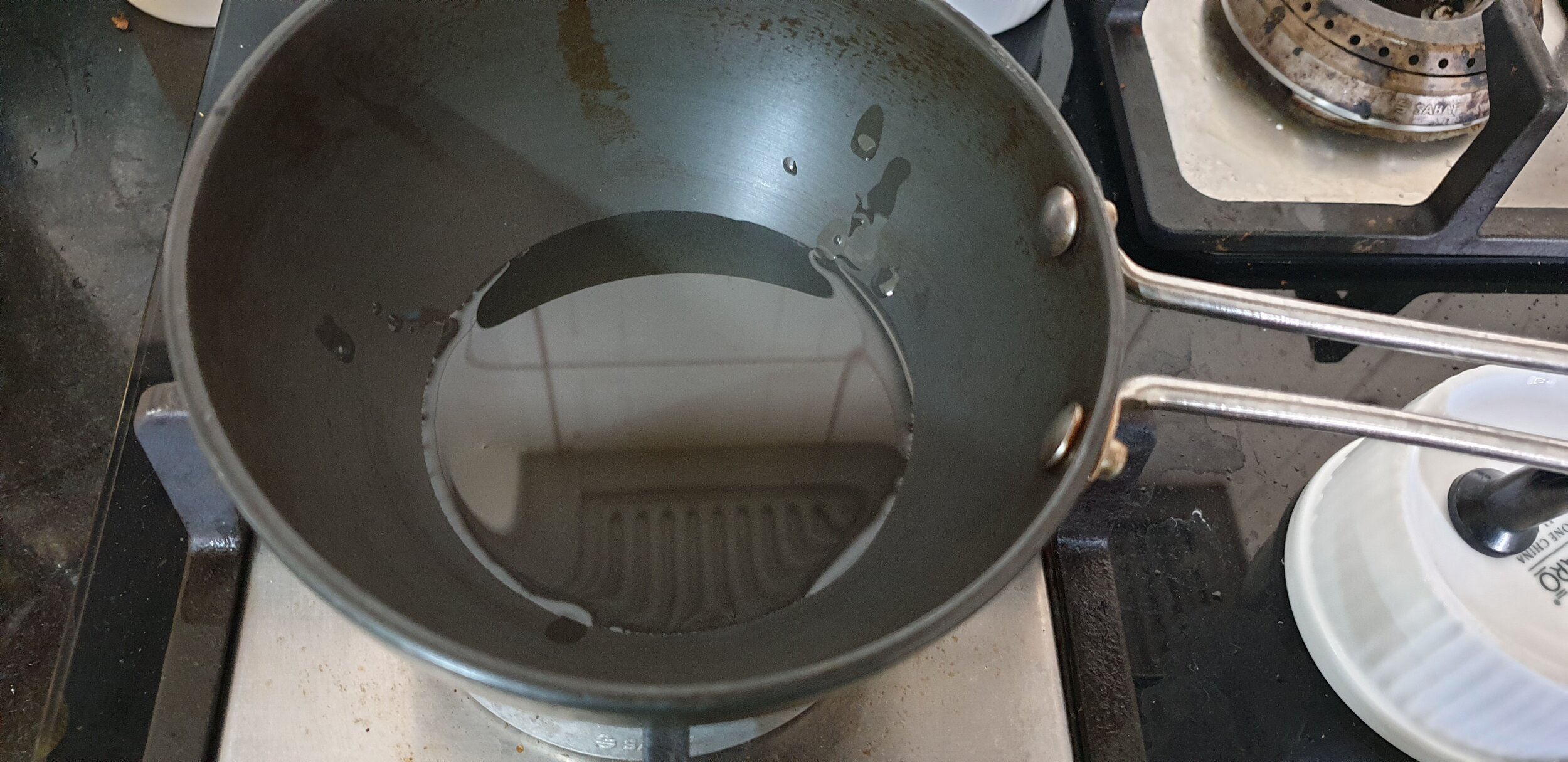 Heat oil in pan till it smokes