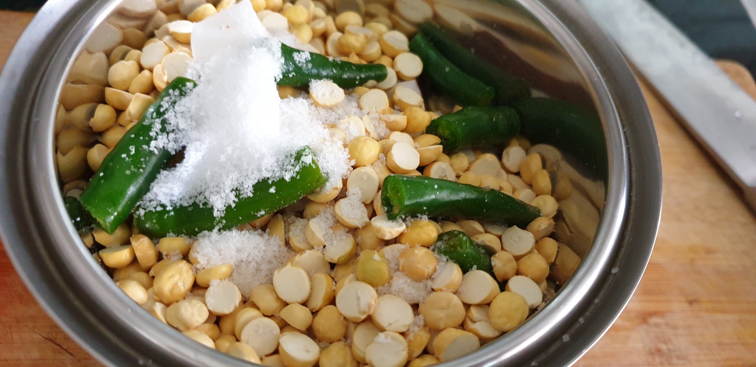 Take Coconut, Green Chillies, Roasted Gram, Salt and Water