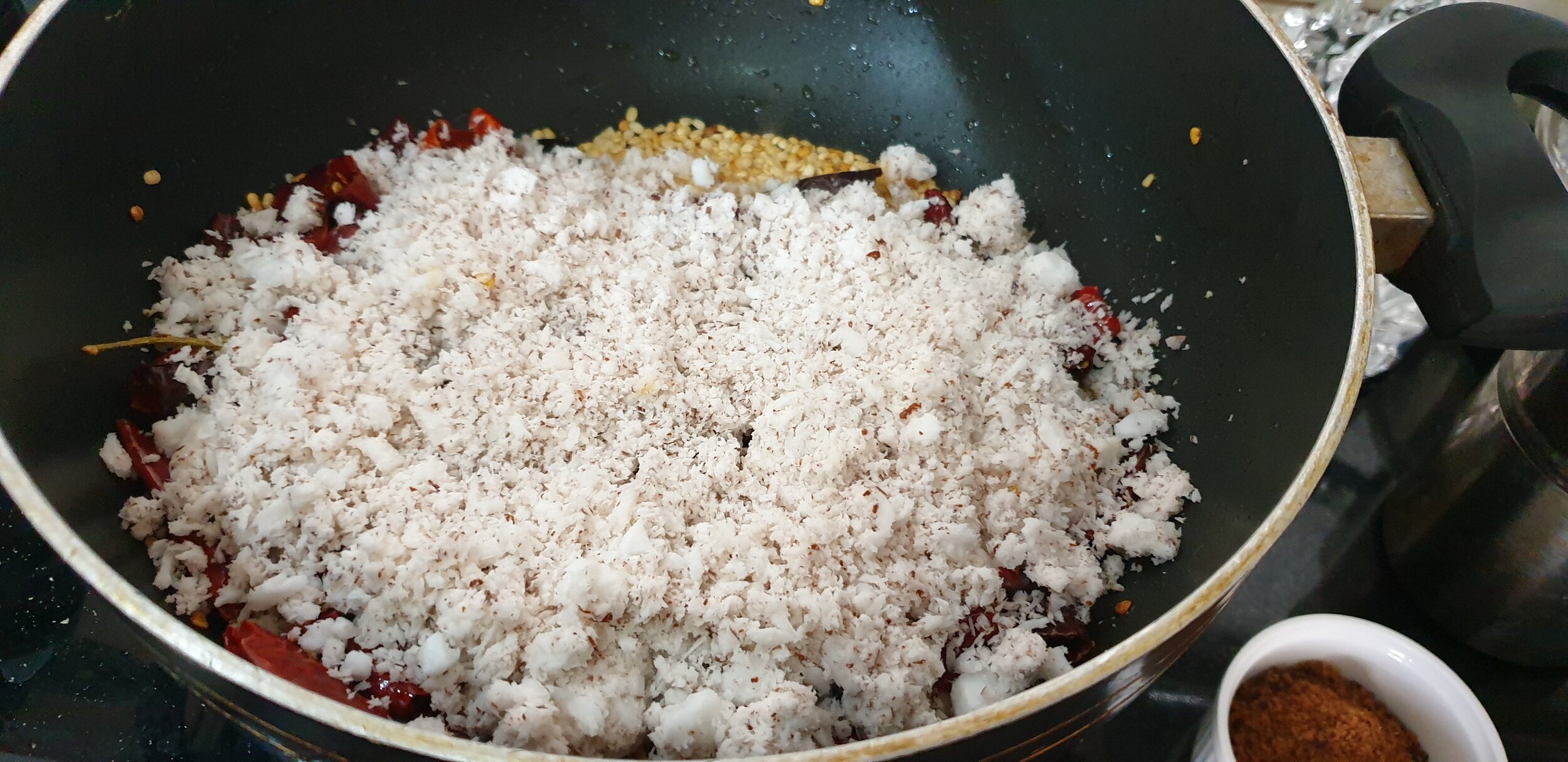 Add coconut and fry for 6-8 minutes